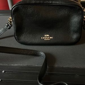 Coach - black medium size cross body purse.